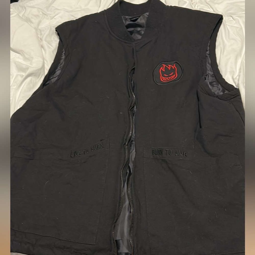Black Vest with Red Patch